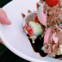 Spumoni Ice Cream · Highlights of rum, chocolate, hazelnut, strawberry, pistachio, cherries.