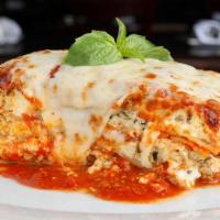 Lasagna · Layered pasta, meat sauce, crumbled meatballs, ricotta, mozzarella, parmesan