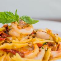 Shrimp Mediterranean · Bowtie, shrimp, sun dried tomatoes, feta, basil, pine nuts, parmesan, garlic – olive oil sauce