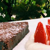 Flourless Chocolate Cake · Homemade chocolate cake, vanilla sauce, powdered sugar…