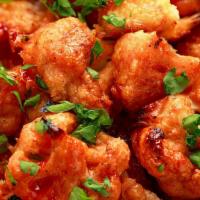 Frizzled Buffalo Cauliflower · bites of cauliflower fried, coated with our spicy
buffalo sauce, served with ranch
