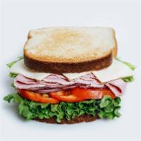 #6 Ham Sandwich · White toast, ham, lettuce, tomato, onion, cheese, mayonnaise , mustard.