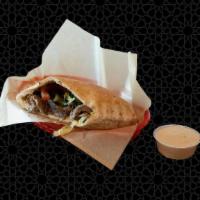 The Og · Inspired by the original Syrian style shawarma. Our Steak shawarma pita, stuffed with parsle...