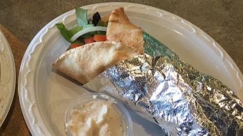 5: Shawarma Wrap · Choice of thinly marinated slices of, beef or chicken wrapped with fresh tomatoes, lettuce, onions, parsley, and tahini sauce.