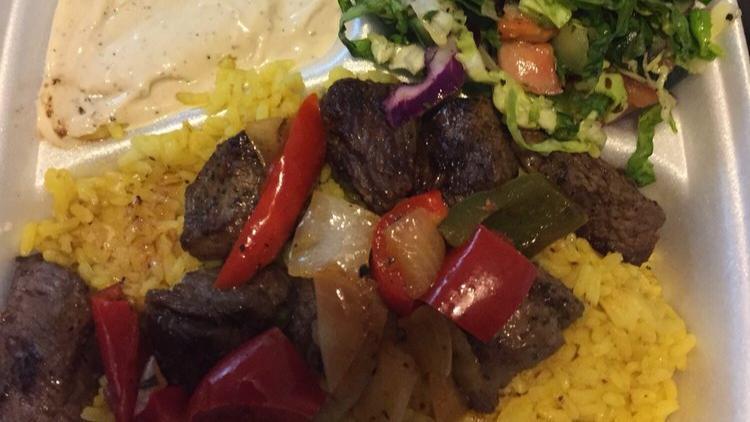 14: Beef Kabob · Grilled vegetable, garlic sauce, salad and pitta bread.