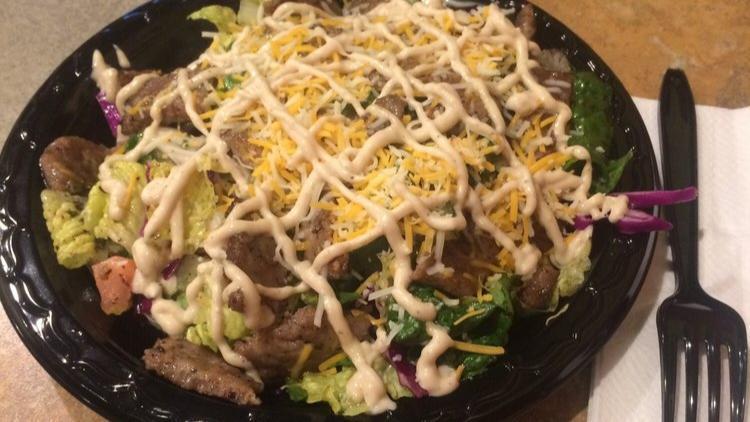 16: Gyro Salad · Grilled beef & lamb, served with our special garlic dressing.