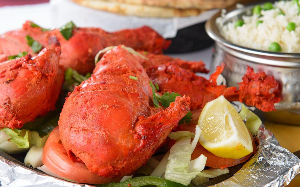 Chicken Tandoori · Chicken legs‏ marinated in ginger, garlic paste and yogurt, then cooked in the tandoor (clay oven), spices.