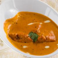 Chicken Curry · Boneless chicken cooked with ginger, garlic and onion sauce.