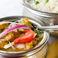 Lamb Curry · Lamb prepared with special sauce from fresh onions, garlic, and spices.