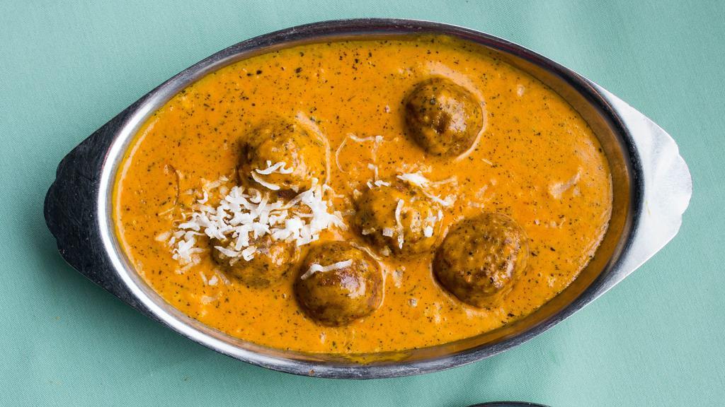 Malai Kofta · Fresh grated vegetables cooked in grain flour, butter and deep fried, served in a fresh cream of tomato and onion sauce.