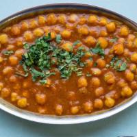 Chana Masala · Garbanzo beans cooked with tomatoes, onions, herbs and spices.