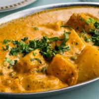 #309 Aloo Mattar · Potatoes and green peas in a spicy gravy.
