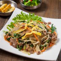  A1. Stir-Fried Glass Noodles (잡채) · Delicious Korean stir-fried glass noodles with beef, mushrooms, onion, carrot, and scallions.