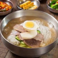 Buckwheat Noodles In Chilled Beef Broth (물냉면) · Refreshing buckwheat noodles in a chilled beef broth. Broth includes sliced cucumbers, beef,...