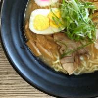Miso Ramen · Ramen noodles with miso pork based broth comes with egg, fish cake two pieces pork and menma.