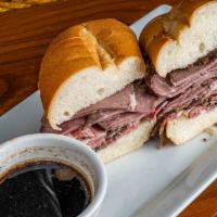 Prime Rib Dip · Shaved prime rib on a soft roll with au jus. Served with French fries.