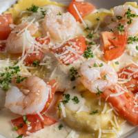 Lobster Ravioli · Lobster filled pasta with diced tomatoes in a lobster cream sauce.