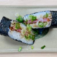 Regular Spam Musubi · Steamed rice and grilled Spam glazed with our own teriyaki sauce and wrapped in nori (seawee...