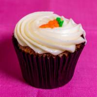 Carrot Cream Cheese · Fresh carrot, raisin, pineapple, walnut cupcake topped with cream cheese frosting.