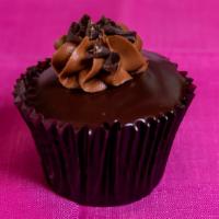 Fudge Yummy · Signature chocolate cupcake centered with chocolate ganache, frosted with a chocolate butter...