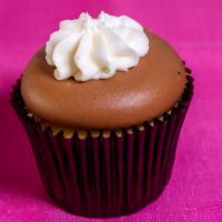 Vanilla & Chocolate · Vanilla bean cupcake frosted with a chocolate buttercream, topped with chocolate pailletes.