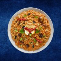 Vegetable Deluxe Biryani · Seasonal veggies cooked in a special biryani masala curry, layered with imported long grain ...