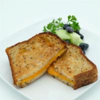 Eazy Grilled Cheezy · Organic Sourdough Bread, Choice of Vegan Cheddar or Real Cheddar.  Comes with a side of frui...
