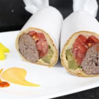 Ground Beef Sandwich · Char-broiled ground beef kabob made into an amazing sandwich with pickles, tomatoes, parsley...