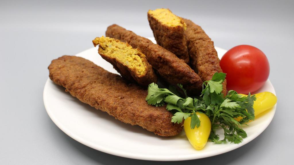 Beef Kotlet · Ground beef mixed with potatoes, eggs, and seasoning before being fried on both sides.