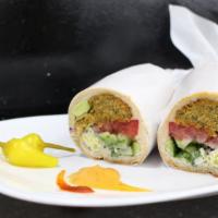 Falafel Sandwich  · 5-6 Falafels wrapped in a toasted  baguette with cucumbers, tomatoes, greens topped with tah...