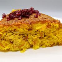 Tahchin With Chicken · Cake like mixture of rice, yogurt, chicken breast strips with fried onions, saffron, and egg...