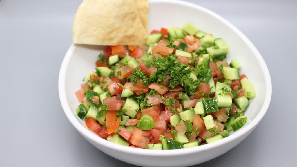 Shirazi Chopped Salad · Chopped cucumbers, tomatoes, and parsley.
Vegan, Gluten-Free
