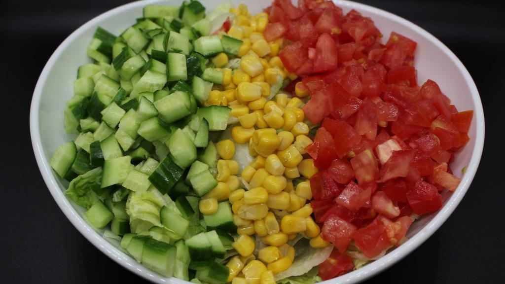 Green Salad · Chopped lettuce, tomatoes, cucumbers, corn with our special house dressing.
Vegan, Gluten-Free