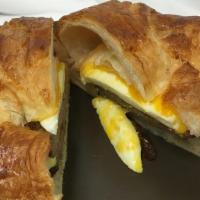 Breakfast Croissant Sandwich  · Over Hard Egg +  Meat + Cheese 
Butter Croissant .