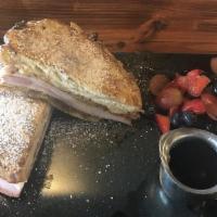 Apple Fritter Monte Cristo · Batter Dipped and Pressed Apple Fritter with Ham, Swiss Cheese - Served with Syrup and Fruit