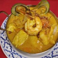 Yellow Curry · Yellow curry paste in coconut milk, potatoes, carrot and onions.