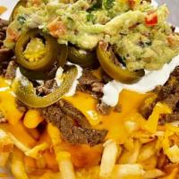 Loaded Fries · French fries with choice of meat: asada, pastor, pollo, sour cream, jalapeños, guacamole, an...