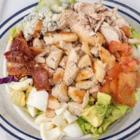 Cobb Salad · Breast of chicken, bacon, egg, avocado, bleu cheese crumbles, mushrooms and tomato.