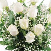 Dozen White Roses · A classic dozen of our finest white roses are truly the height of indulgence! Spoil someone ...