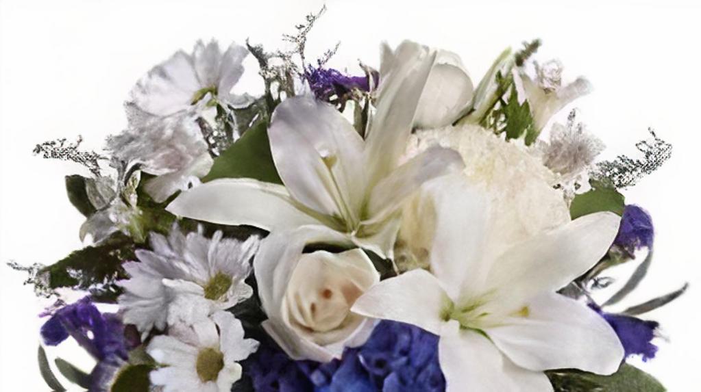 Beautiful Blue Bouquet · This elegant bouquet will be a lovely addition for any occasion. The beautiful blue flowers stand out among the white lilies, roses, and other fresh plants.