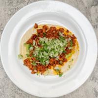 Adobada Taco · Guacamole, onion & cilantro.