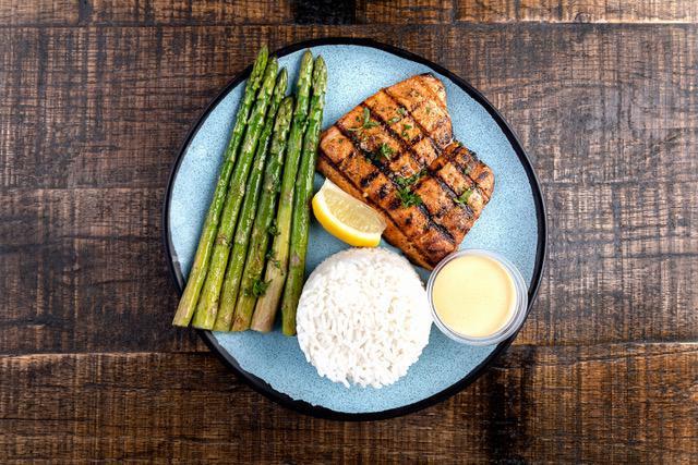 Salmon Plate · Grilled, served with two sides & sauce of your choice on the side.
