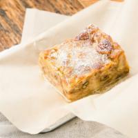 Bread Pudding · Served with whiskey sauce. Contains dairy and nuts.