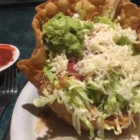 Grilled Chicken Tostada · Achiote baste chicken breast, refried beans, lettuce, cheese, tomatoes, olives, all in a cri...