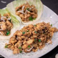 Chicken Lettuce Wraps · Minced chicken with mushrooms, water chestnuts, and green onion wok stir fried in a house sa...