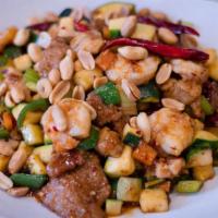 Combination Kung Pao · Chicken beef and shrimp with zucchini celery and carrots stir fried in a spicy kung pao sauc...