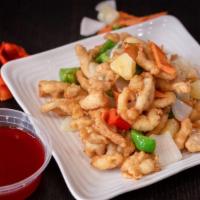 Sweet And Sour Chicken · Crispy breaded white meat chicken with bell pepper omen carrots and diced pineapple glazed w...