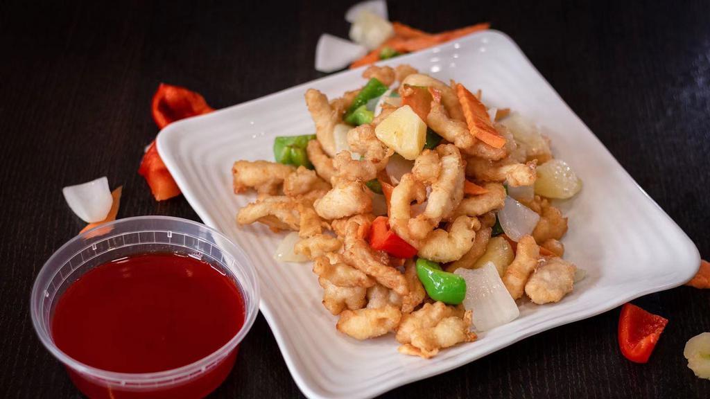 Sweet And Sour Chicken · Crispy breaded white meat chicken with bell pepper omen carrots and diced pineapple glazed with sweet and sour sauce.