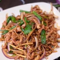 Ginger And Onion Pork · Pork strips with green onion bamboo shoots and ginger stir fried in a house sauce.