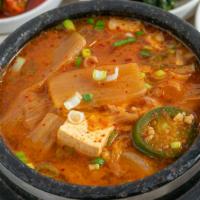 Kimchi Jji Gae · Spicy kimchi stew with beef lunch special with variety of side dishes and rice.